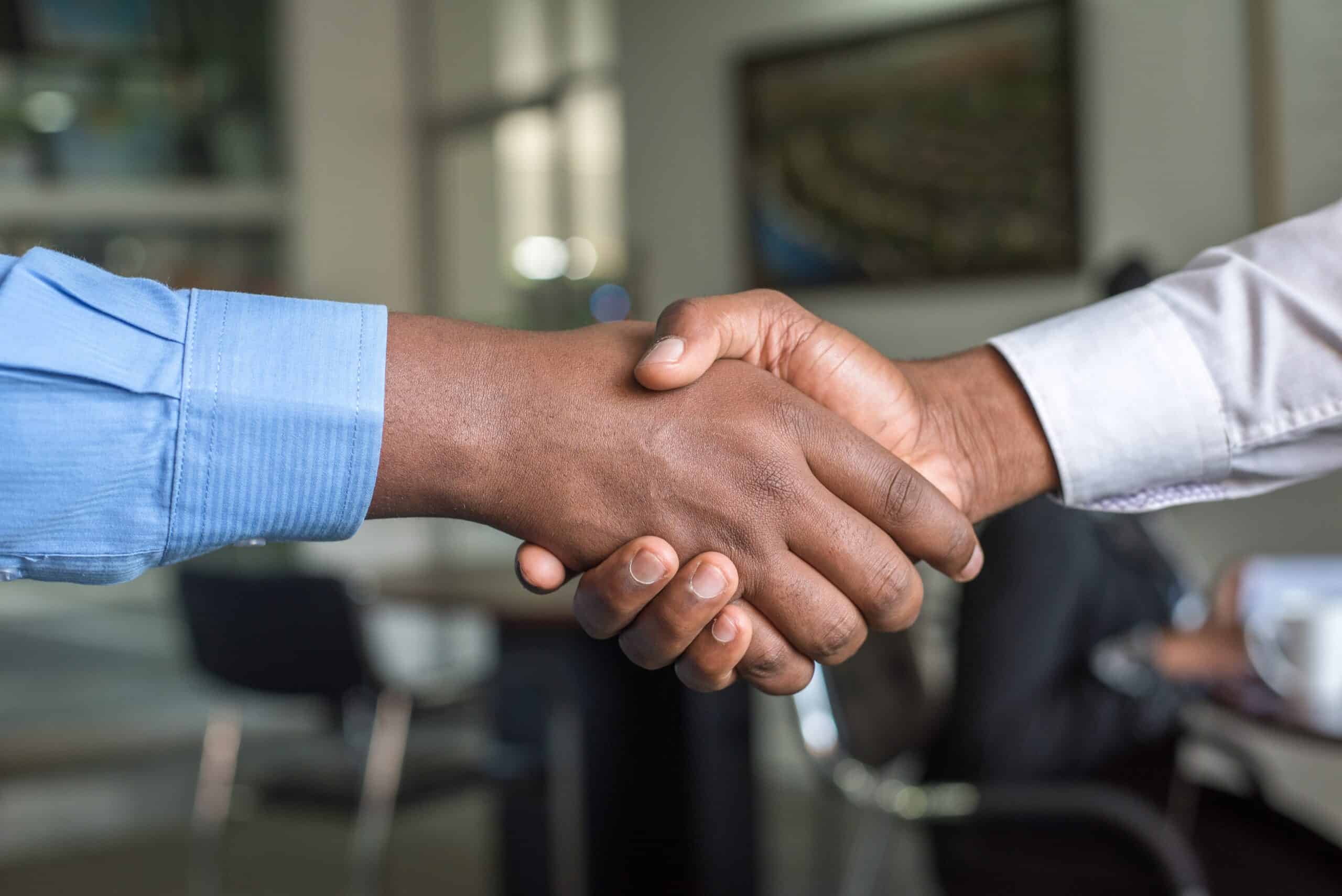 Photo of two people shaking hands